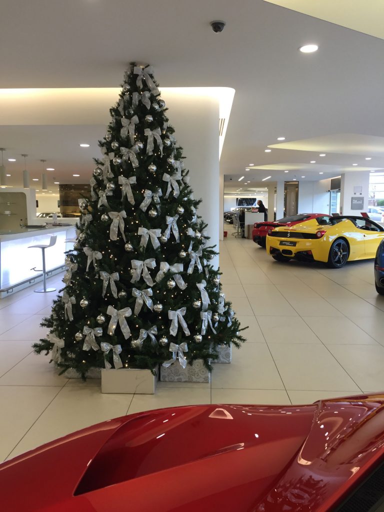 Christmas tree with white decorations in Ferrari showroom