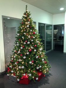 Office Christmas tree with silver and red decorations